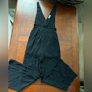 Fancy low cut black jumpsuit with side cutouts